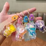 Cute Spaceman Liquid Quicksand Keychain - Galaxy Bottle Bag Charm